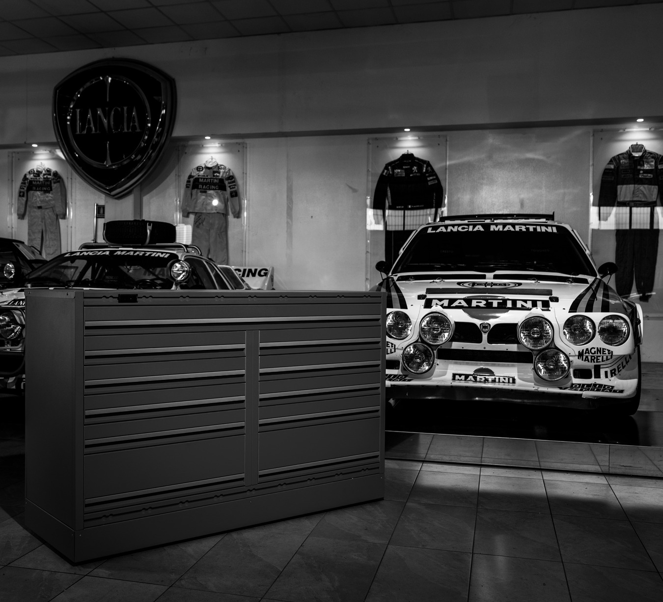 Superleggera in garage with rally car